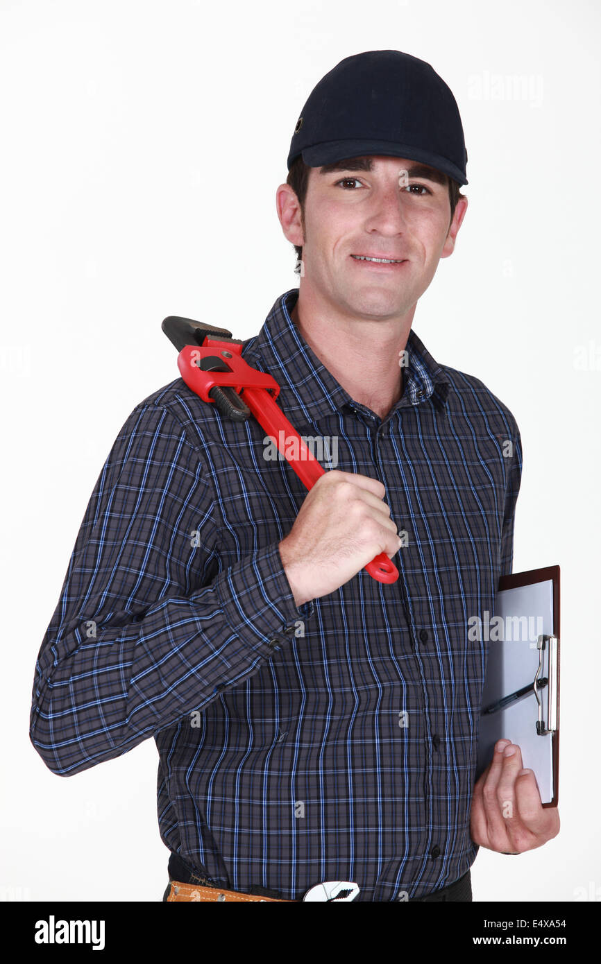 Handwerker mit Schraubenschlüssel und Clip-board Stockfoto