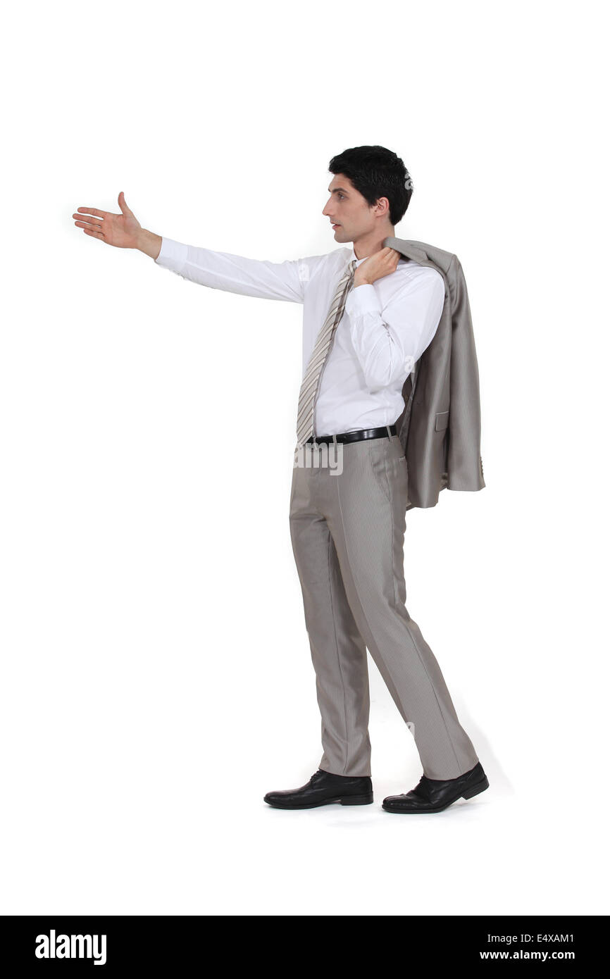 Lässige Geschäftsmann hält sich arm Stockfoto