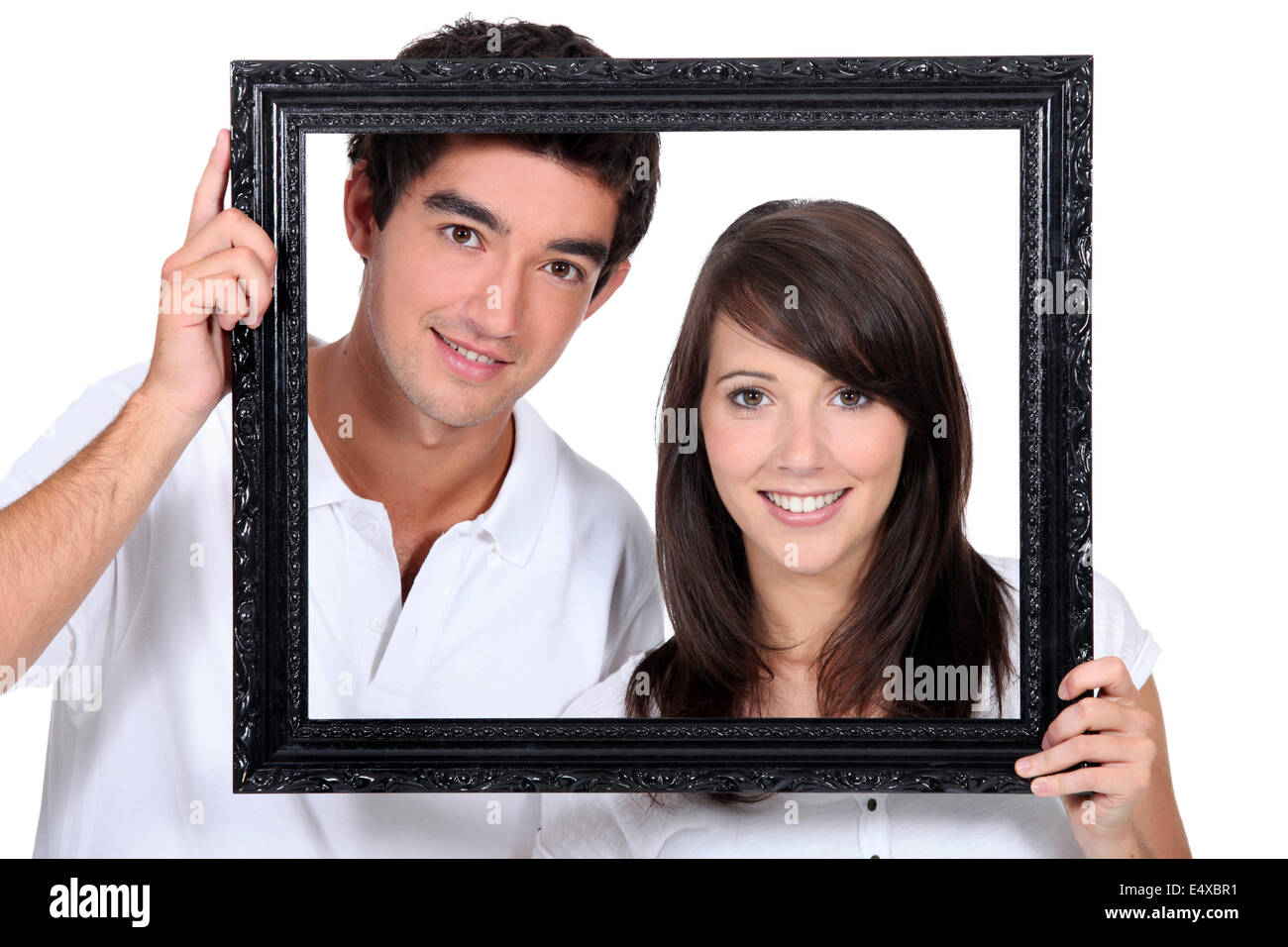 Paar mit leeren Bilderrahmen Stockfoto