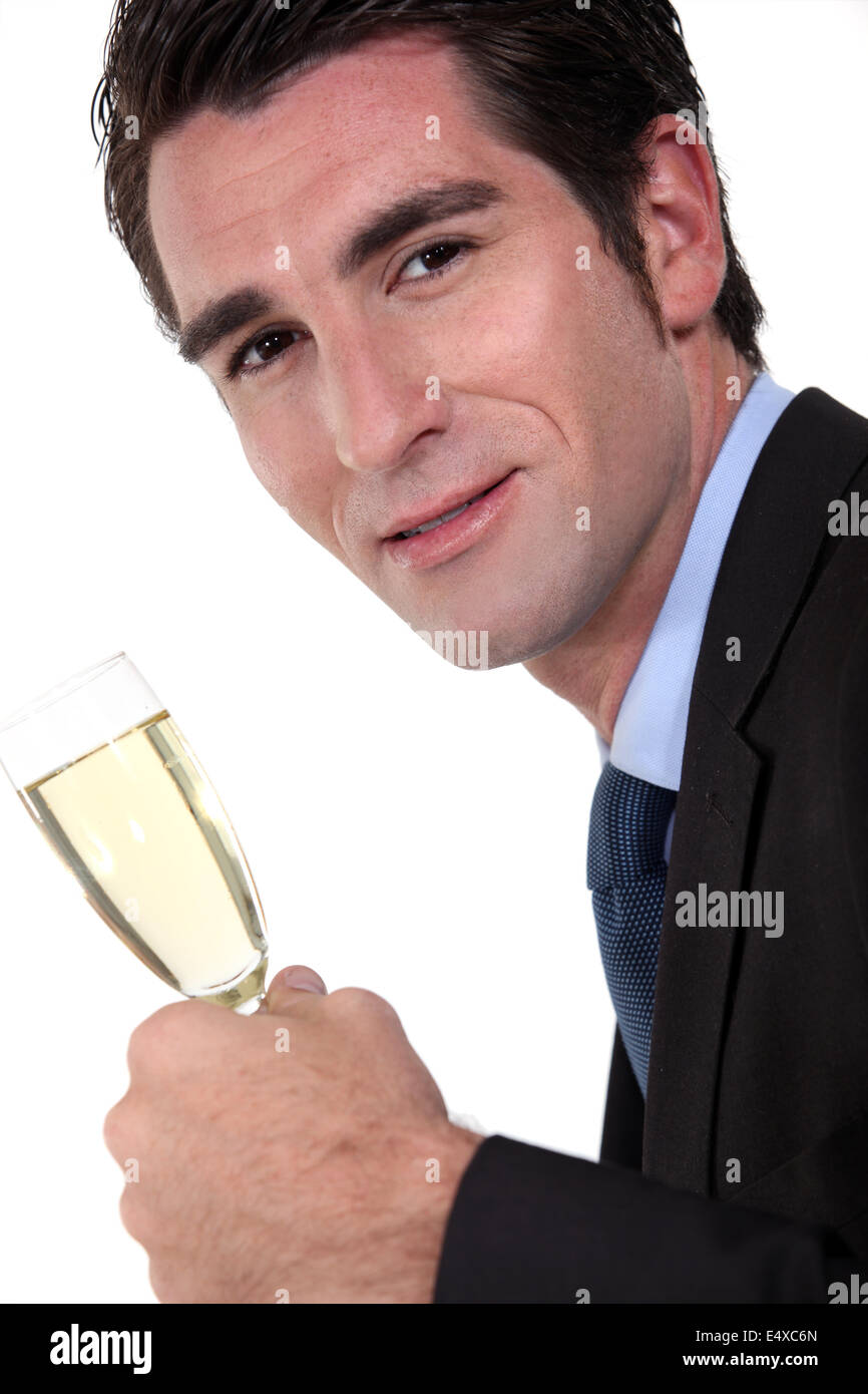 Geschäftsmann Holding Champagne flute Stockfoto