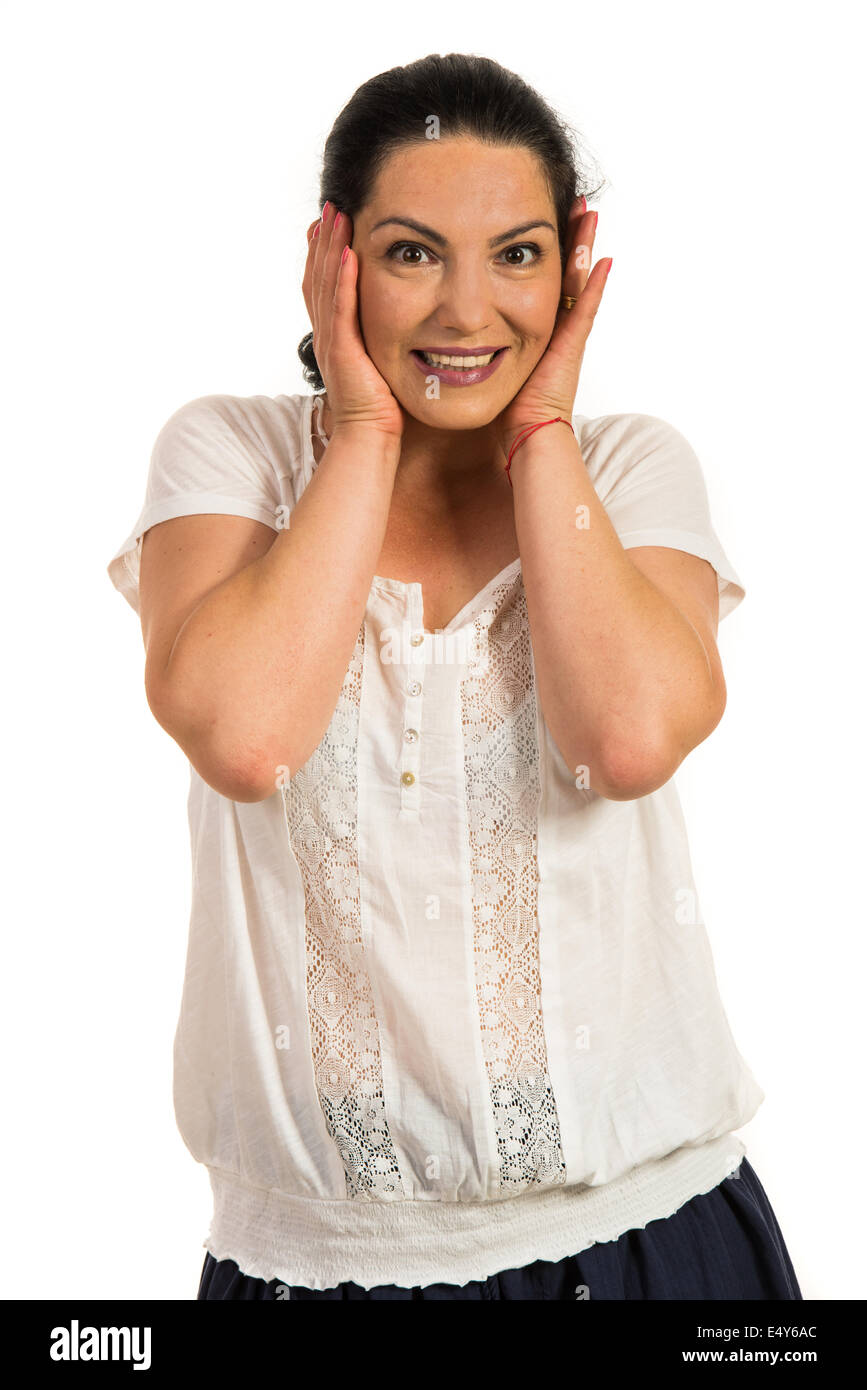 Erstaunt glücklich lässige Frau mit Händen auf Gesicht isoliert auf weißem Hintergrund Stockfoto