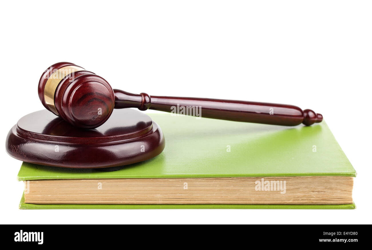 Holz braun Hammer und grünes Buch Stockfoto