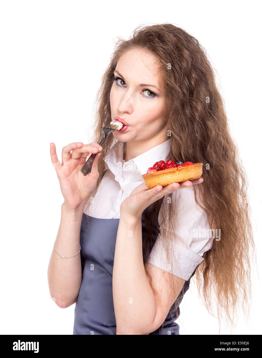 Frau genießen Sie Kuchen Stockfoto