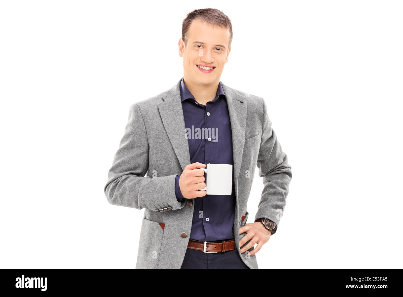 Elegante Mann hält eine Kaffeetasse Stockfoto