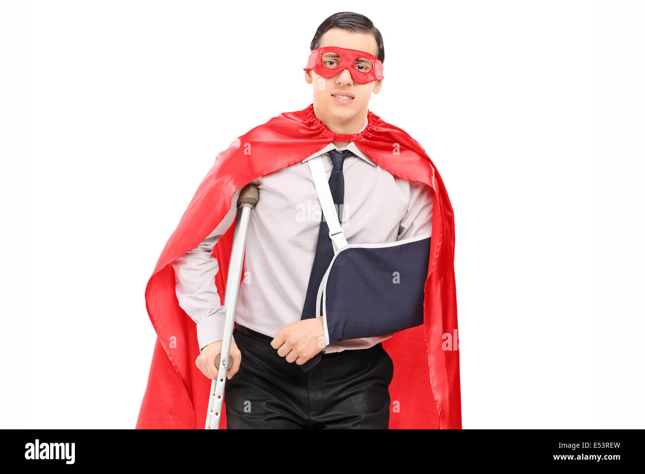 Männlichen Superhelden mit gebrochenen Arm und ein Bein Stockfoto