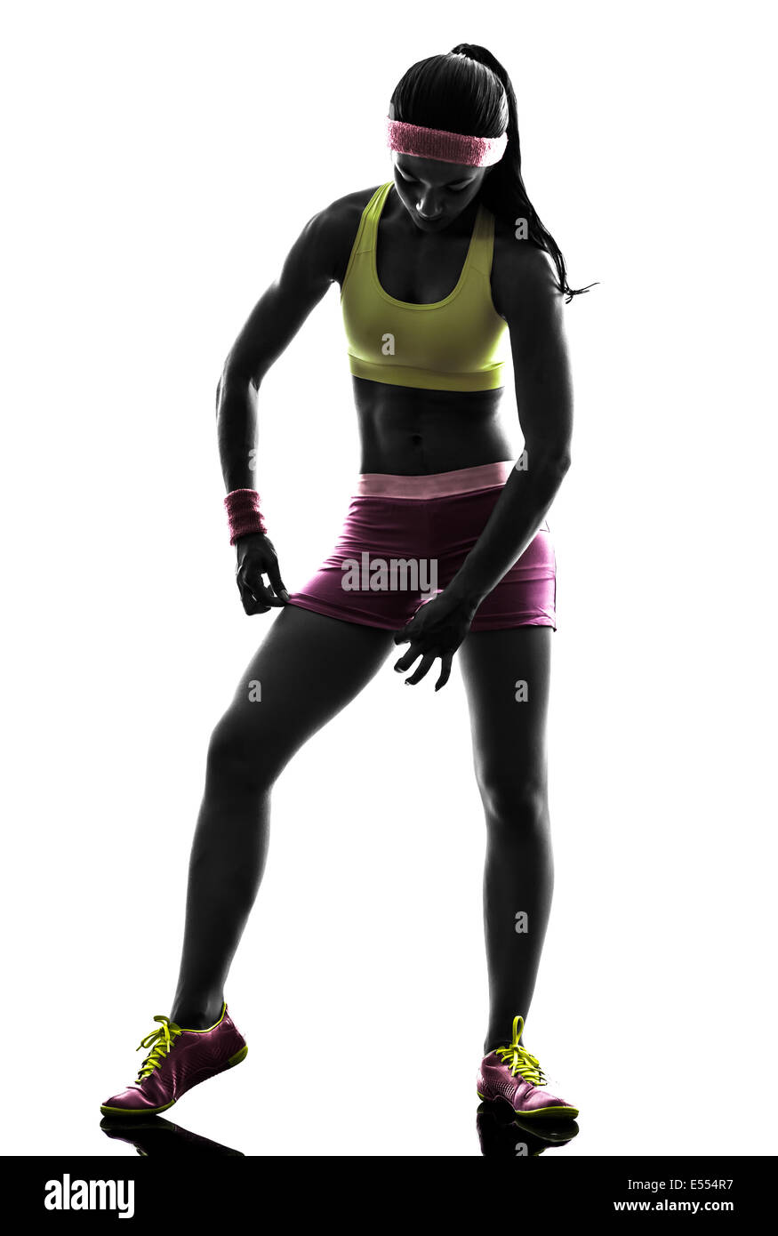 eine Frau, die Ausübung Fitness Sportbekleidung Silhouette auf weißem Hintergrund anpassen Stockfoto