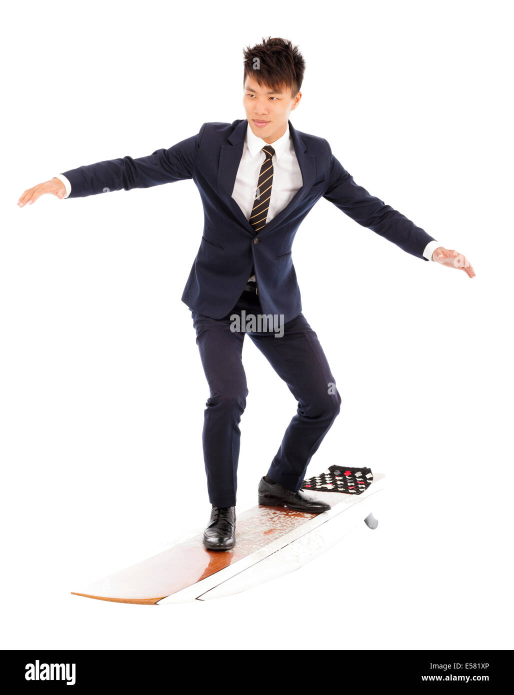 Geschäftsmann Praxis Surfen Pose mit Anzug Stockfoto