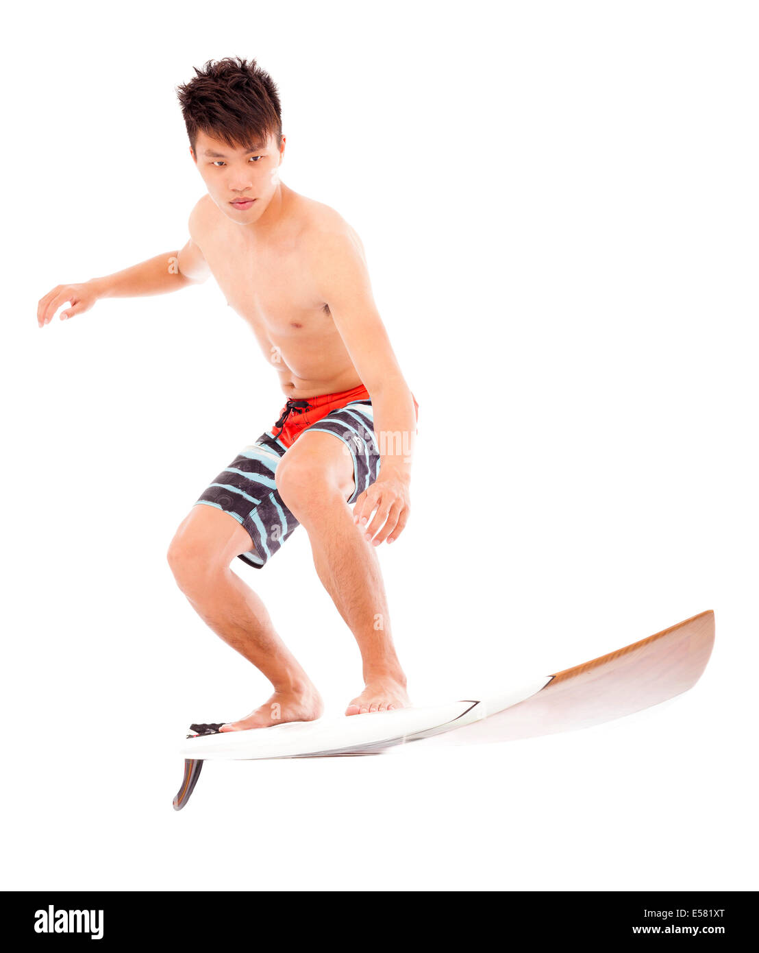 junge Profisurfer Praxis Surfen pose Stockfoto