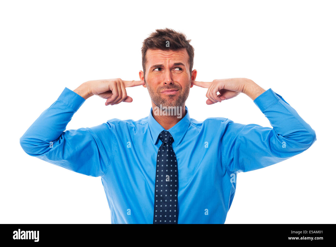 Ekel Geschäftsmann mit den Fingern in den Ohren, Debica, Polen Stockfoto
