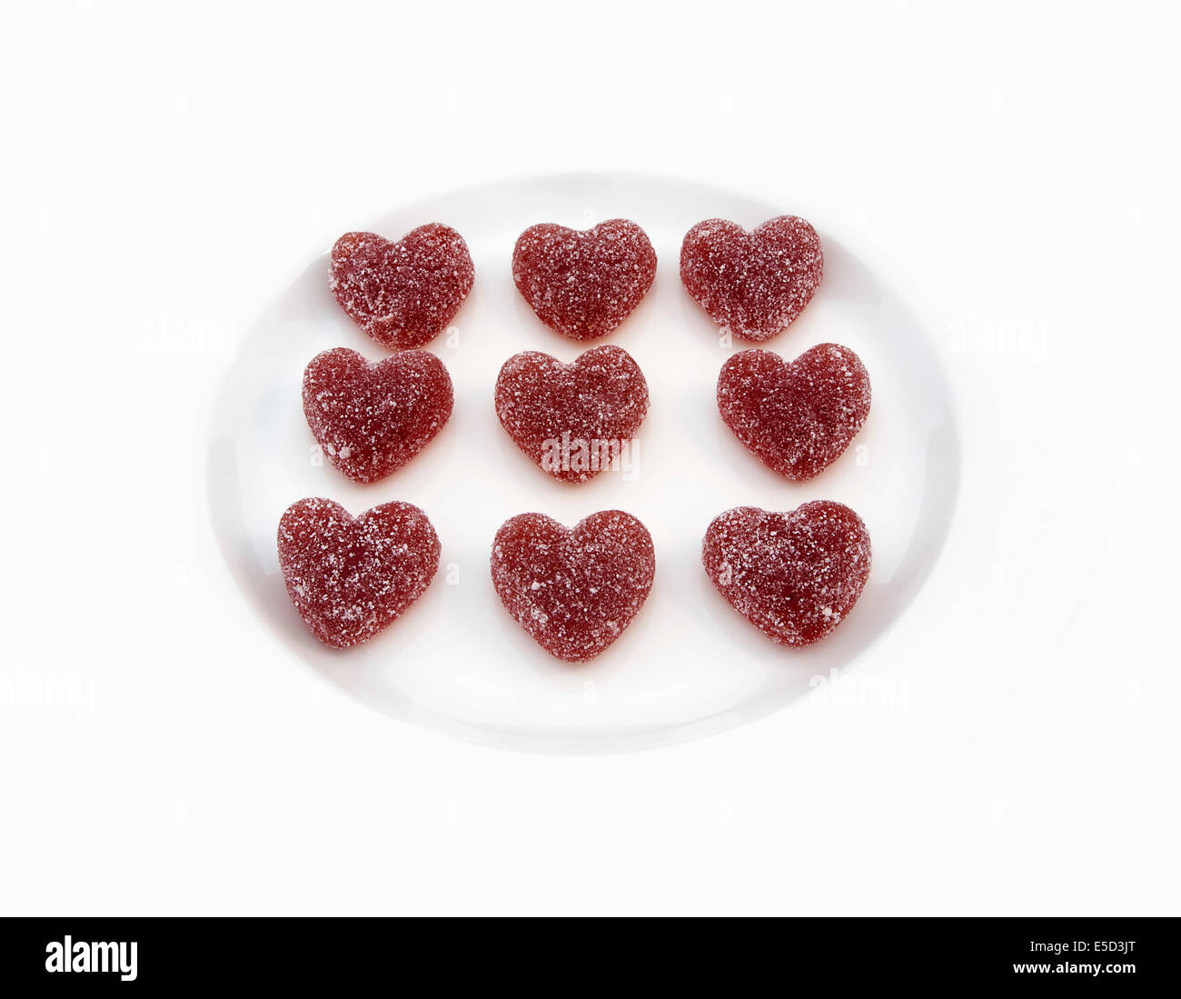 Lebensmittel, Süßigkeiten, Bonbons, rote farbige Jelly Herzen in Zucker überzogen. Stockfoto