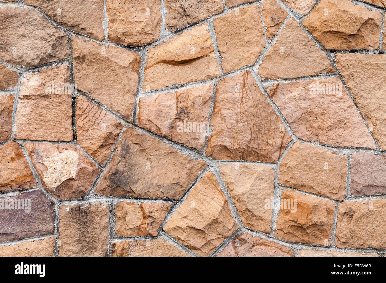 Alte rote Steinmauer Hintergrundtextur Foto Stockfoto