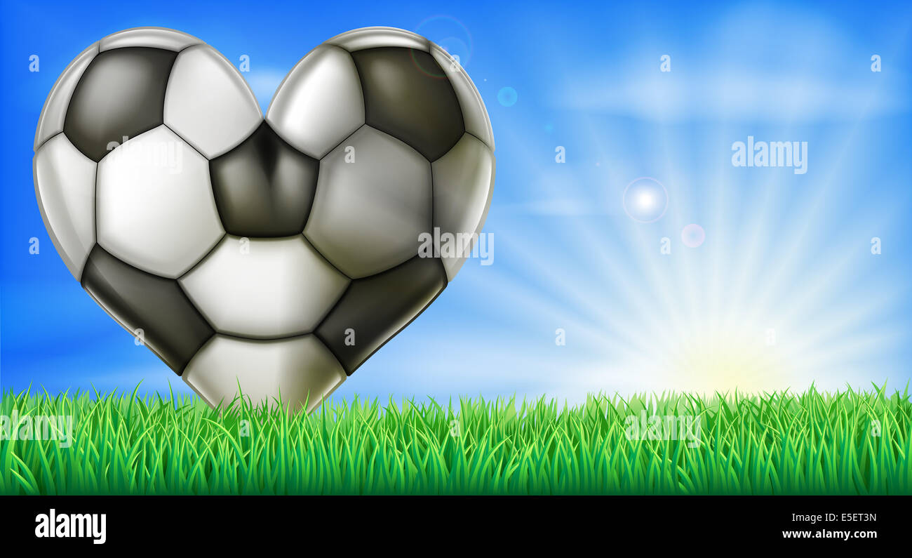 Eine herzförmige Fußball in einem grünen Feld Rasenplatz. Konzeptionelle Darstellung für die Liebe zum Fußball Stockfoto