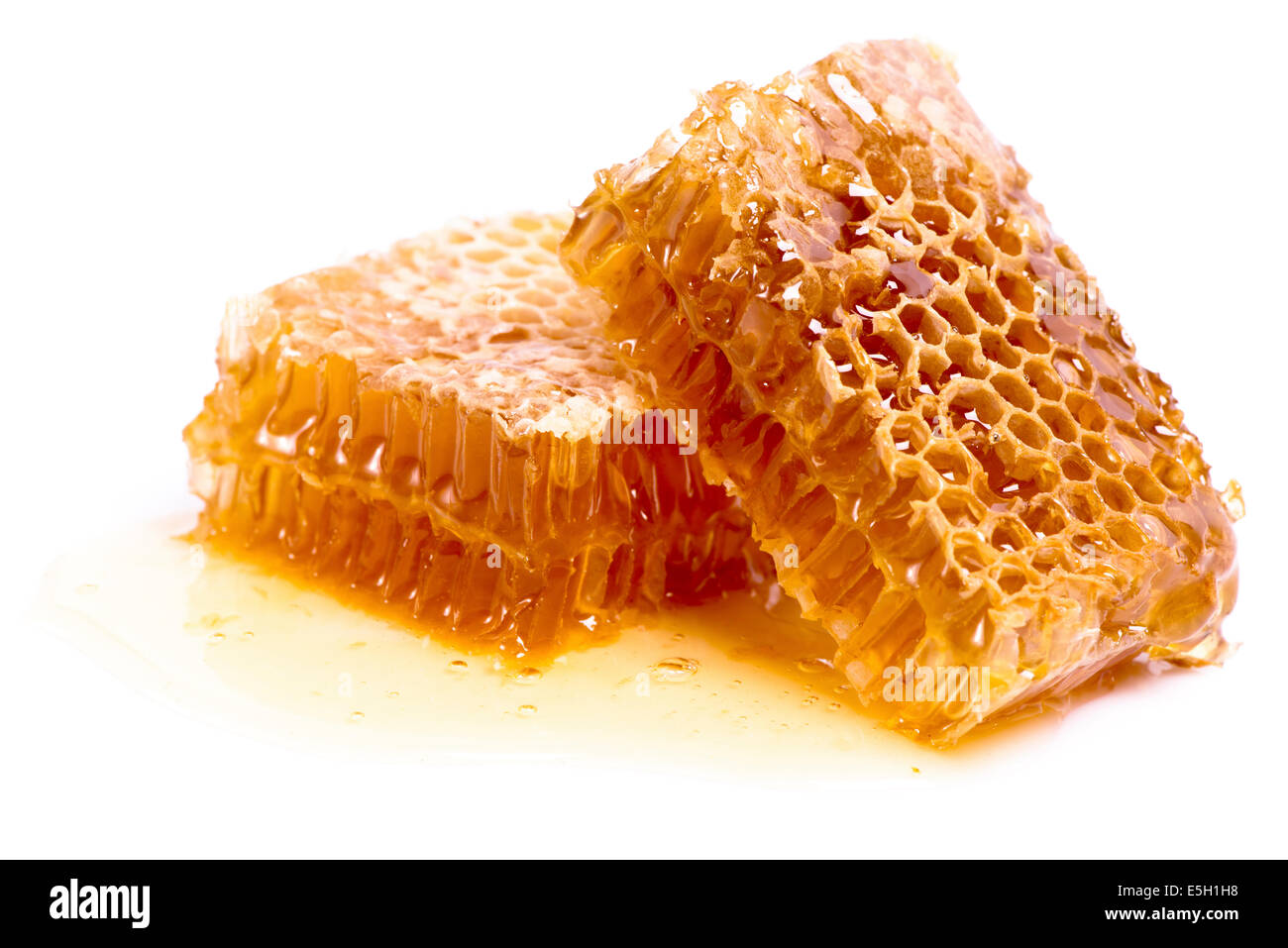 Wachs Waben mit Honig isoliert auf weißem Hintergrund Stockfoto