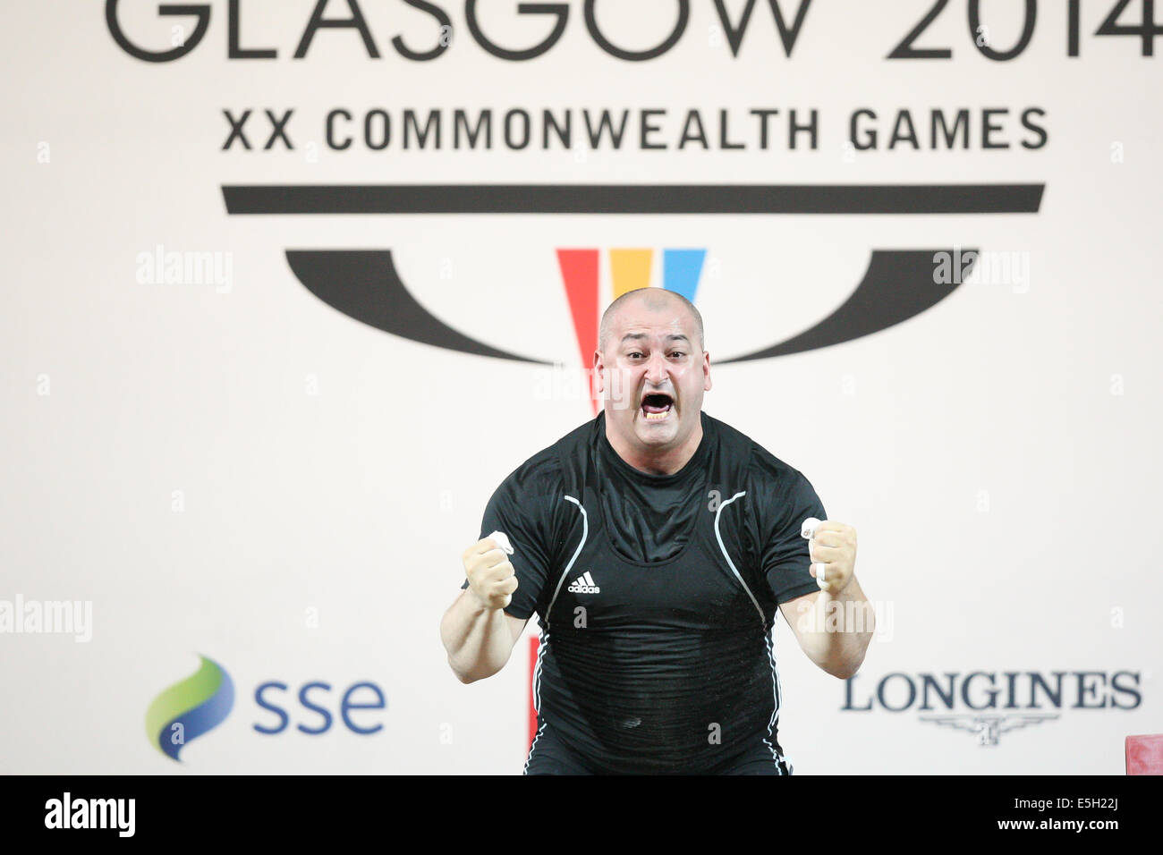 Glasgow, Schottland. 31. Juli 2014. Glasgow Commonwealth Games. Tag 8 im Clyde Auditorium. Herren Gewichtheben 105kg Gruppe A. Gold: George Kobaladze können, insgesamt 400 und drei neue Datensätze (sauber und Ruck 223kg, 229kg und insgesamt 400kg) erzielen. Silber: Itte Detenamo NRU, final score 396 und ein Rekord gebrochen (und stossen 222kg). Bronze: Damon Kelly AUS, final score 388. George Kobaladze aus Kanada - allgemeine Gewinnerin. Bildnachweis: Aktion Plus Sport/Alamy Live-Nachrichten Stockfoto