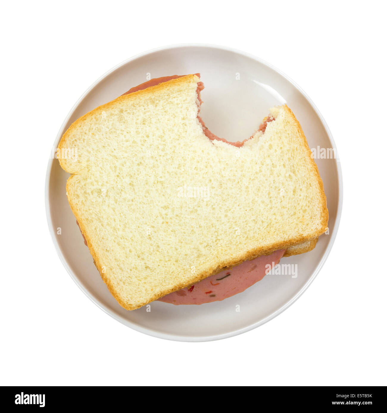 Gebissen P & P Laib Brot mit Weißbrot auf einen kleinen Teller. Stockfoto