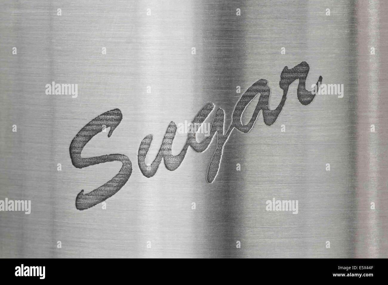 Das Wort Zucker auf einem Edelstahl-Hintergrund Stockfoto