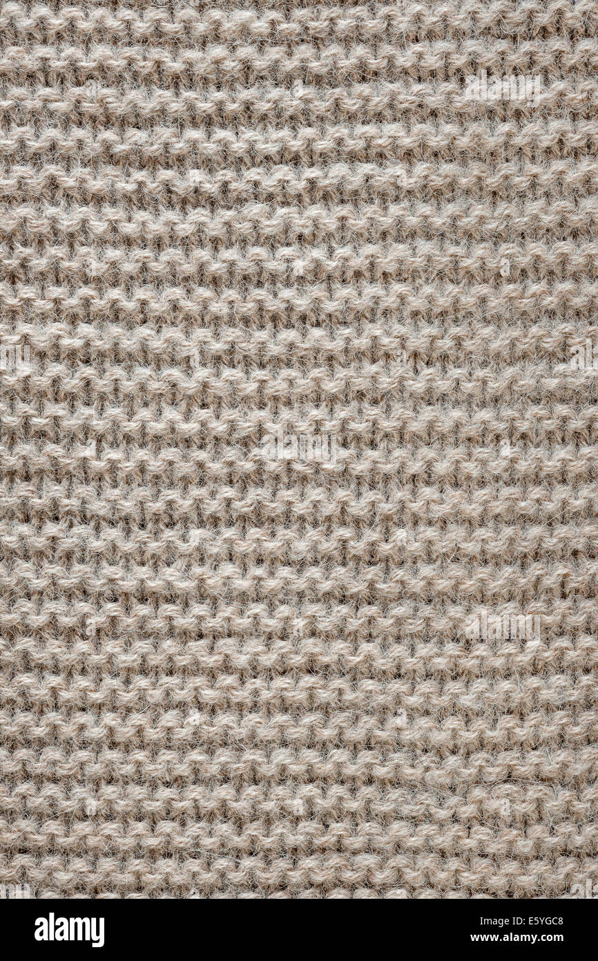 Gestrickte Textur der ungefärbte Naturwolle braun Gestrick mit Strumpfband Stichbild als Hintergrund Stockfoto