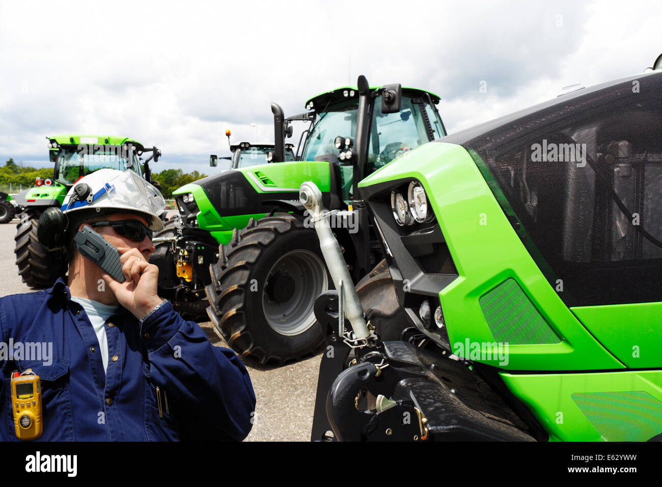 Fahrer und landwirtschaftliche Traktoren Stockfoto