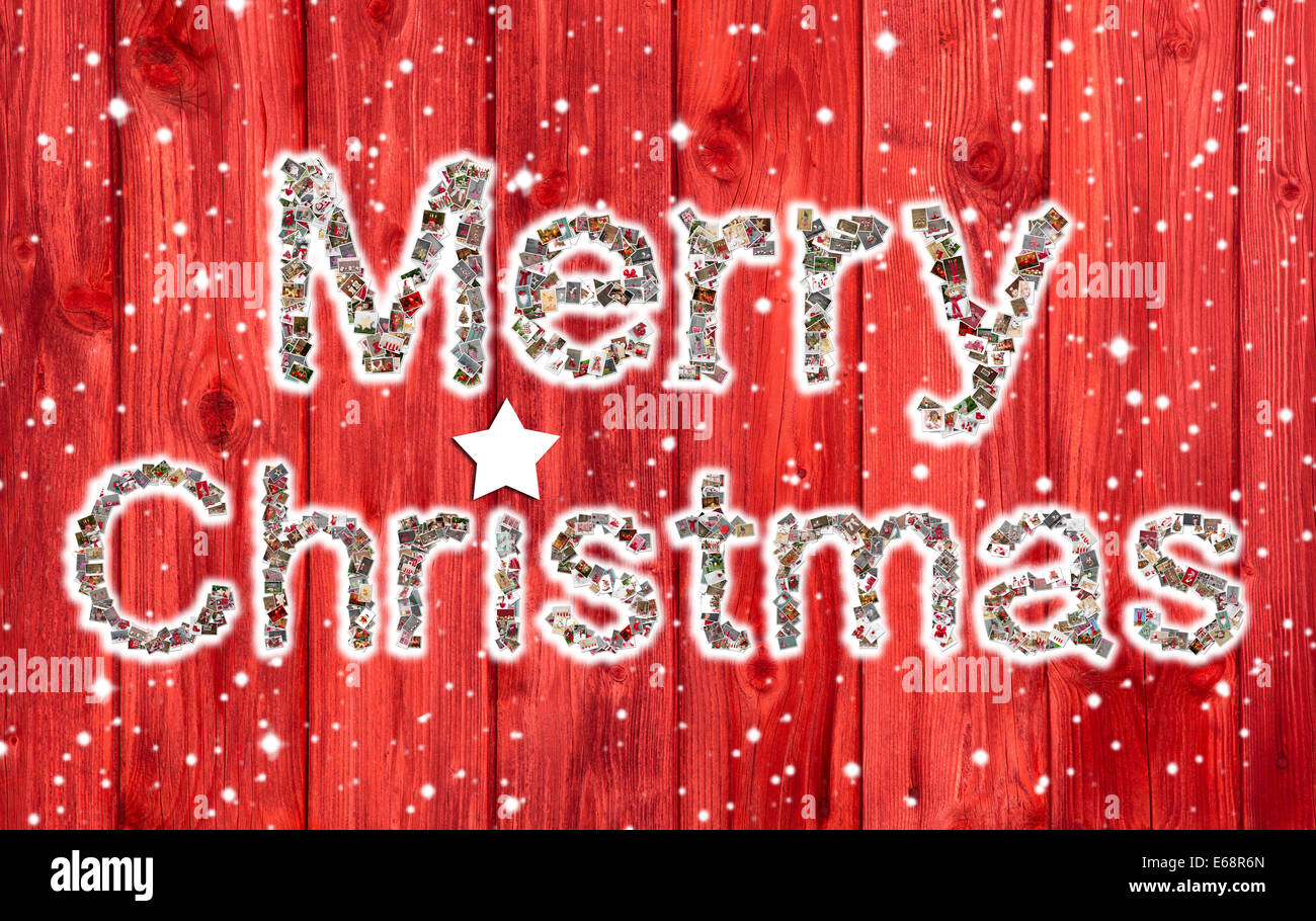 Frohe Weihnachten Text auf rotem Grund aus Holz. Stockfoto