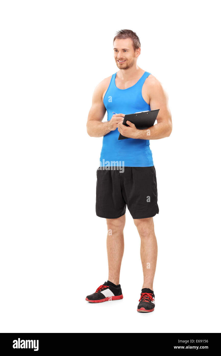 In voller Länge Portrait von einem Fitness-Coach hält eine Zwischenablage Stockfoto