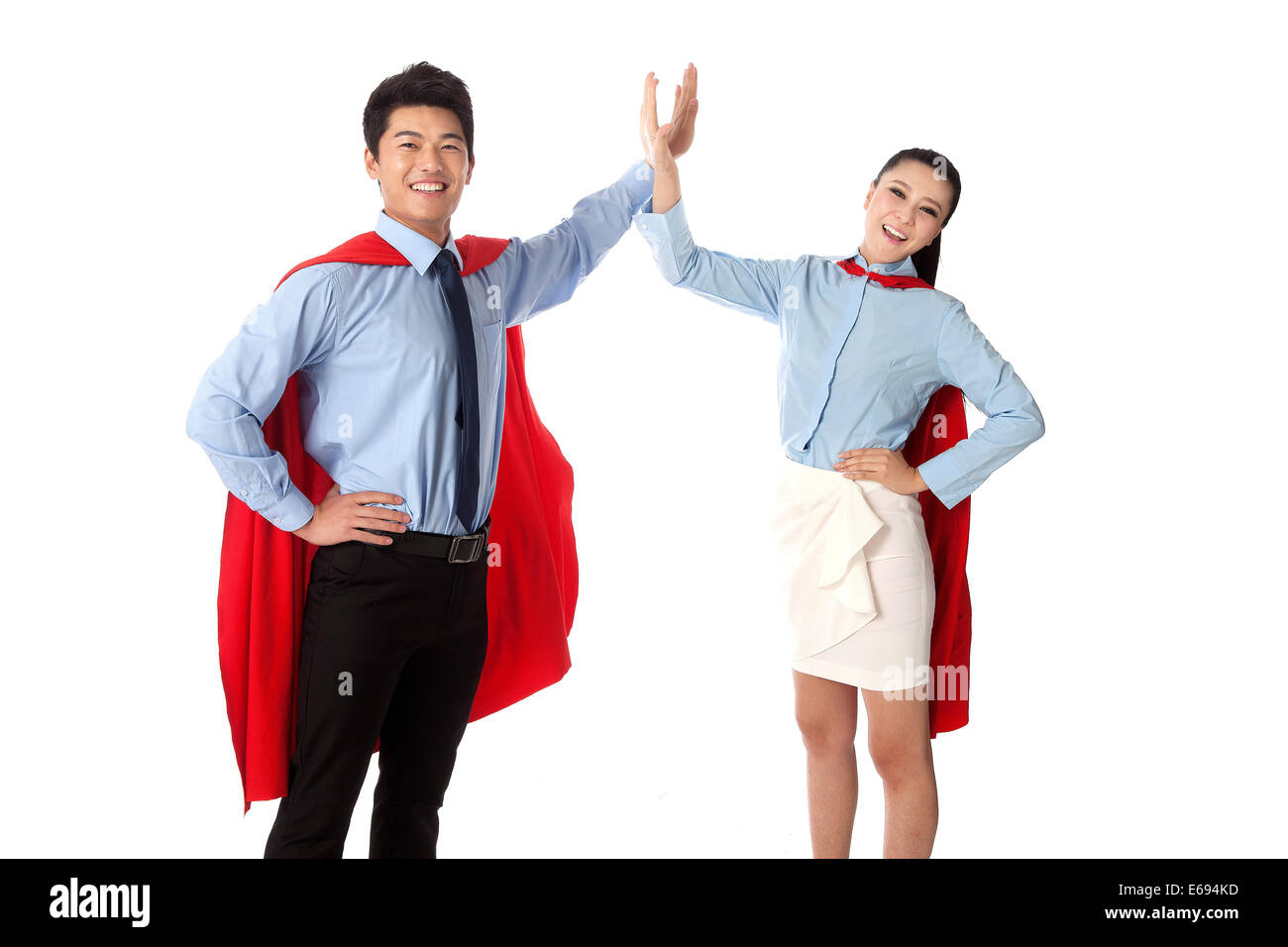 Junger Mann und junge Frau in Superman outfit Stockfoto