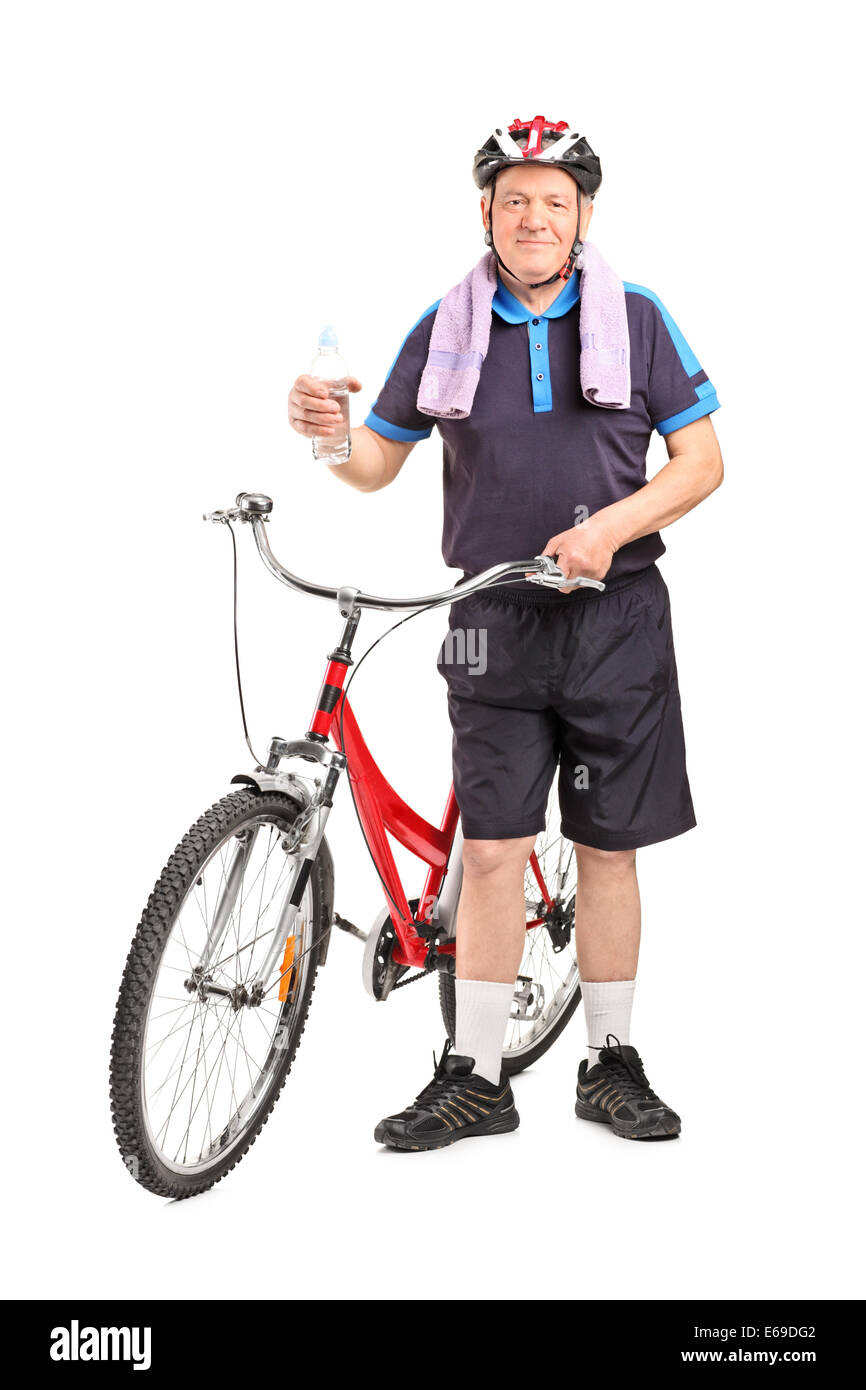 In voller Länge Portrait von Reifen Biker hält eine Flasche Wasser Stockfoto