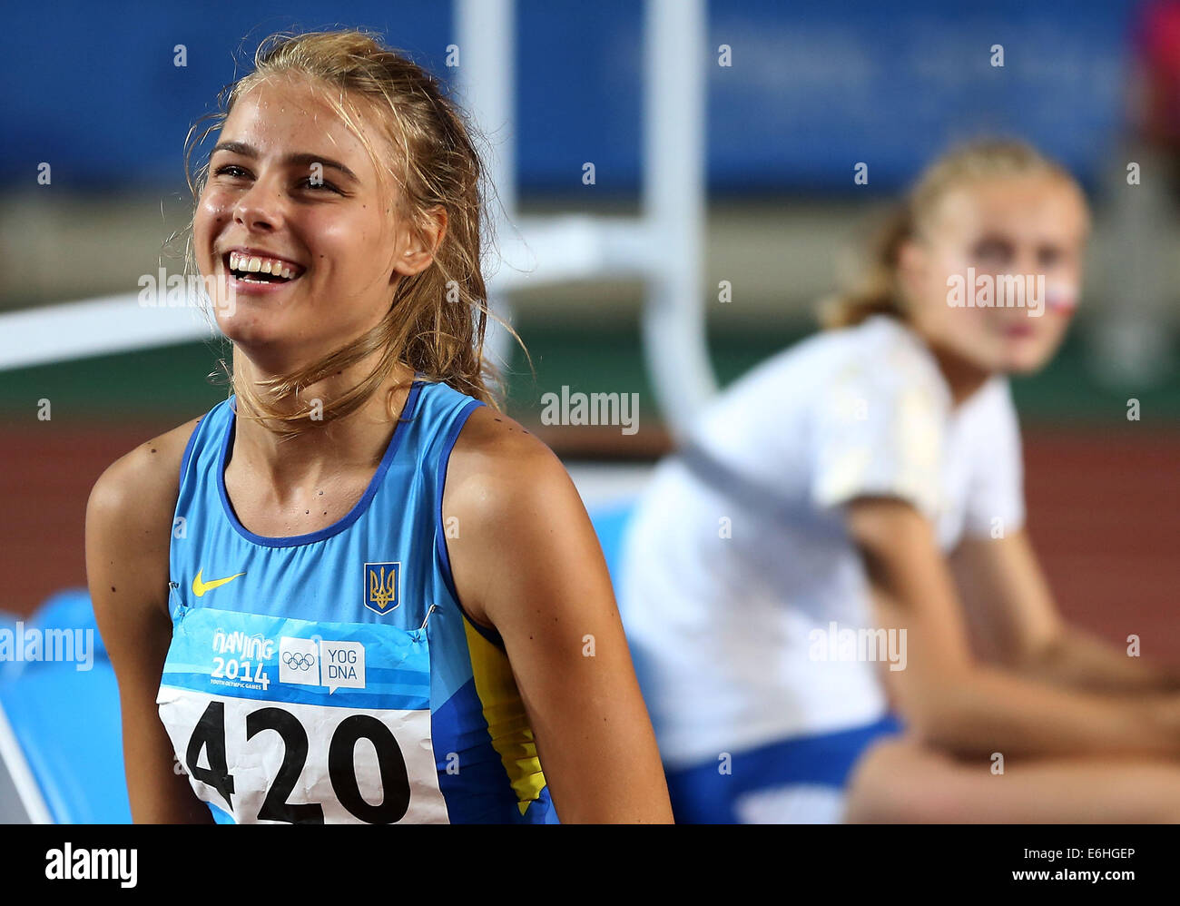 Nanjing, China Jiangsu Provinz. 24. August 2014. Goldmedaillengewinner Yuliya Levchenko der Ukraine feiert nach dem Gewinn der Frauen Hochsprung-Event der Leichtathletik-Wettbewerb bei Nanjing 2014 Olympischen Jugendspielen in Nanjing, der ostchinesischen Provinz Jiangsu, 24. August 2014. Bildnachweis: Liao Yujie/Xinhua/Alamy Live-Nachrichten Stockfoto