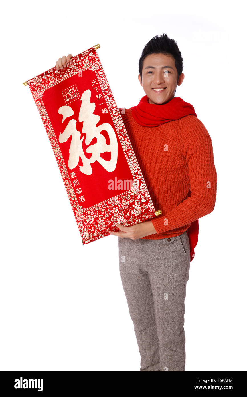 Junger Mann feiert Chinesisches Neujahr Stockfoto