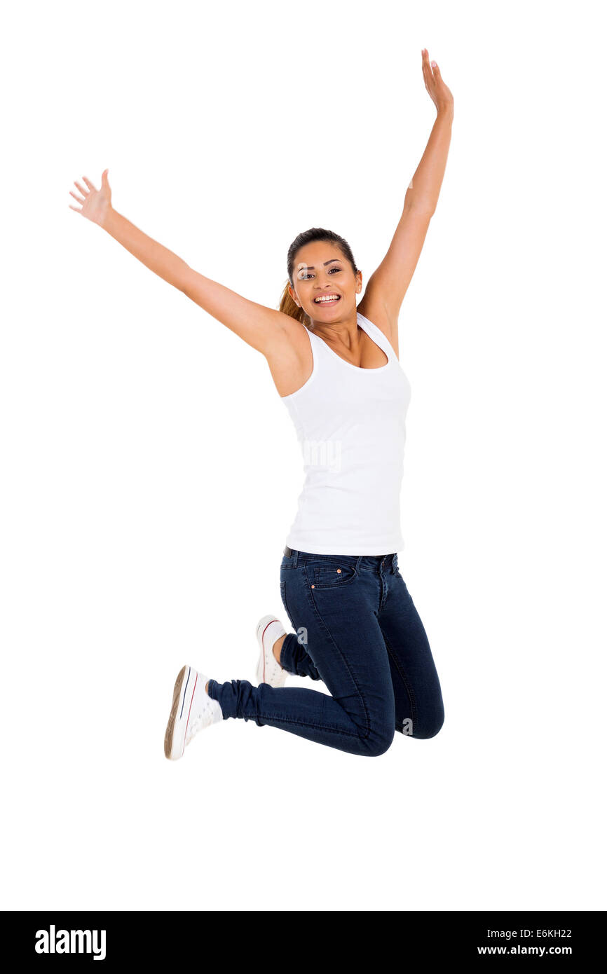 erregte junge Frau springt auf einfarbigen Hintergrund Stockfoto