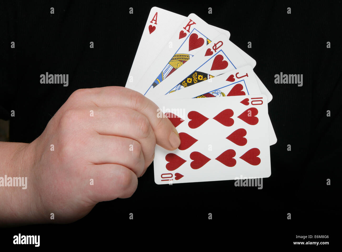 Royal Flush - höchste Pokerblatt auf dunklem Hintergrund Stockfoto