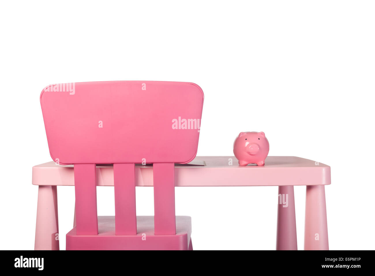 Sparschwein auf ein Kind Schreibtisch isoliert auf weißem Hintergrund Stockfoto