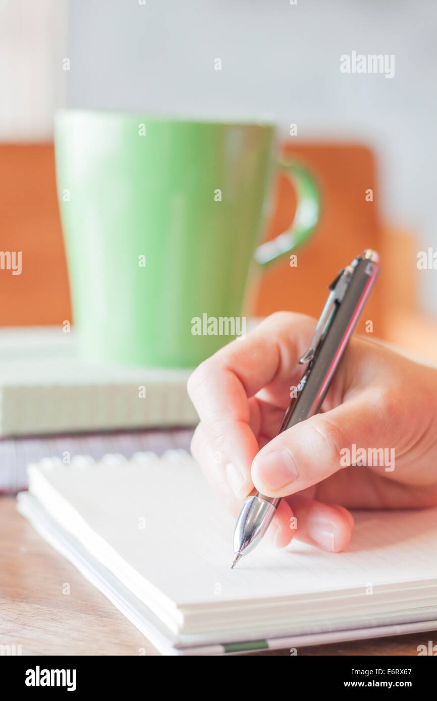 Handschrift mit grünen Becher Hintergrund, Fotoarchiv Stockfoto