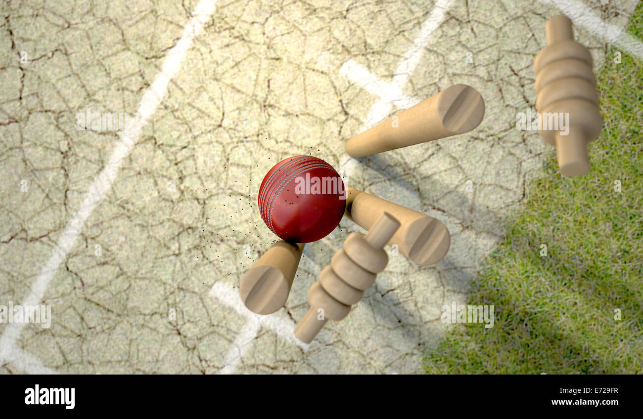 Ein rotes Leder Cricketball schlagen Holz Cricket Wickets auf Rasen Cricket Pitch Hintergrund Stockfoto