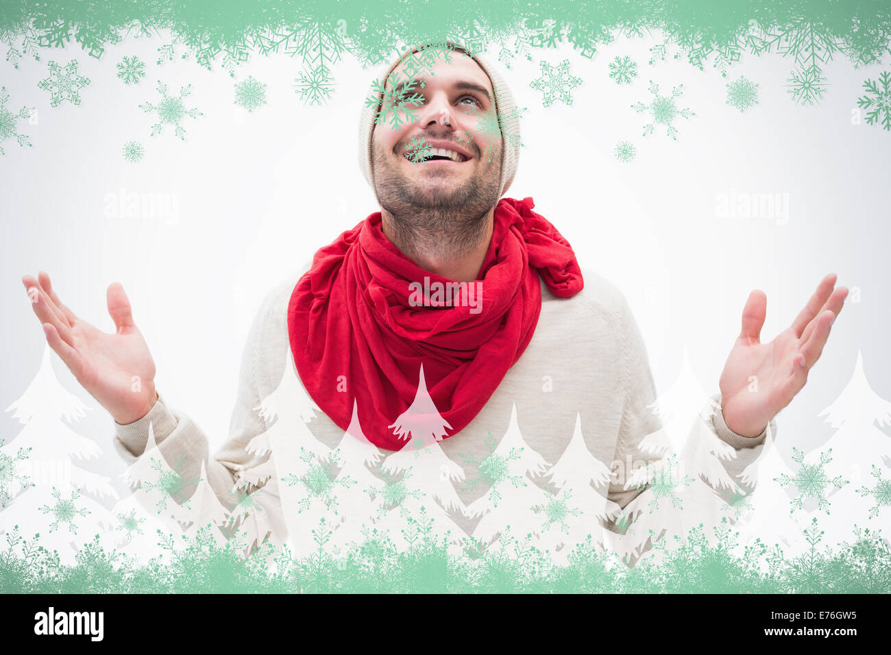 Zusammengesetztes Bild attraktive junge Mann in warme Kleidung mit Hände hoch Stockfoto