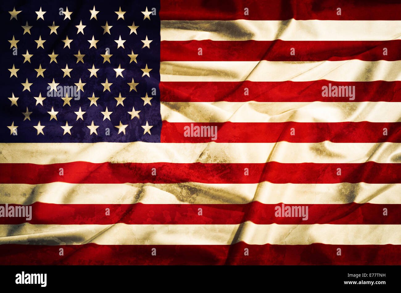 Alte Flagge der Vereinigten Staaten Grunge gelb auf einem seidenen Tuch Stockfoto