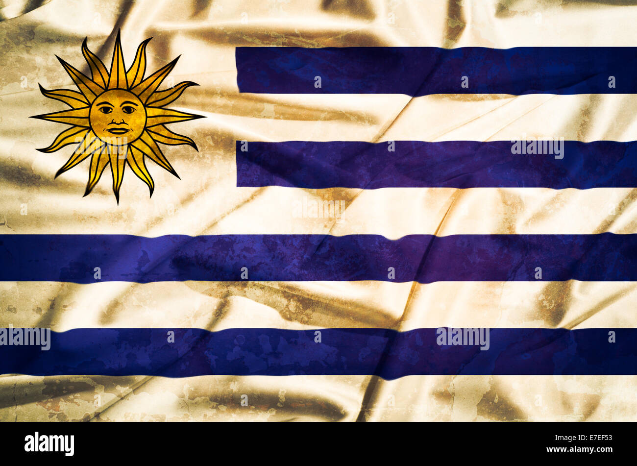 Uruguay-Grunge-Flagge auf einer Seide drapieren winken Stockfoto