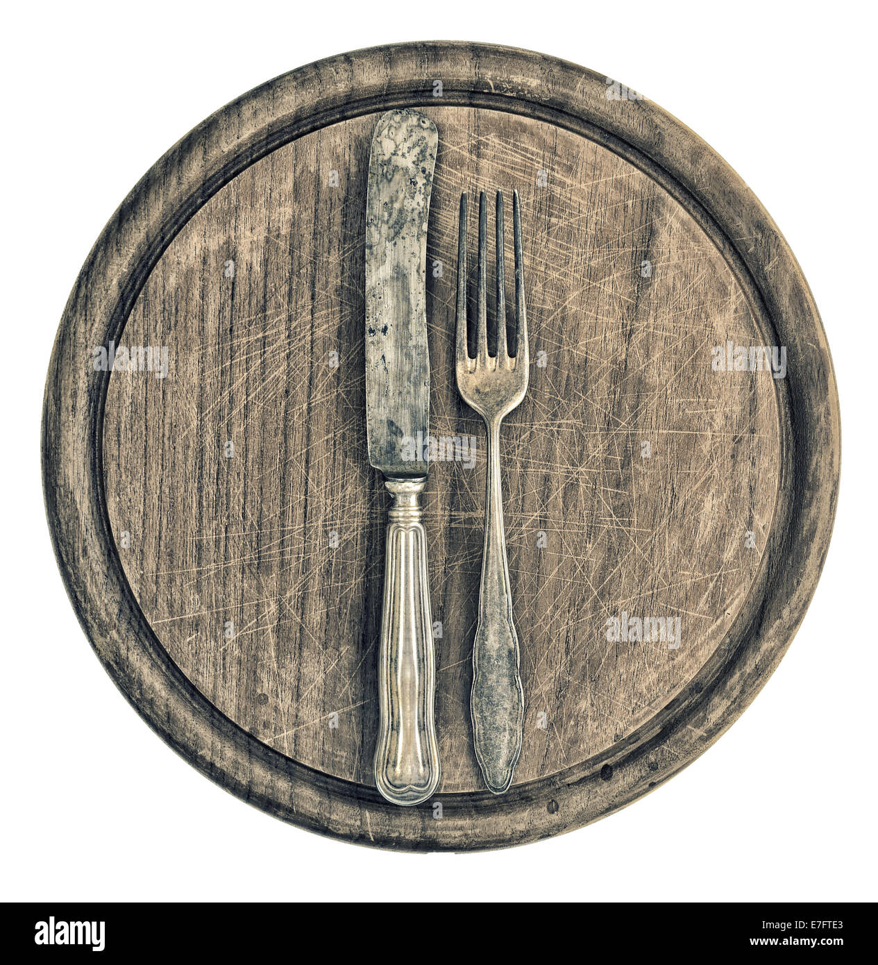 antikes Silberbesteck und rustikalen Holzbrett. Küchenutensilien. Retro-Stil getönten Bild Stockfoto