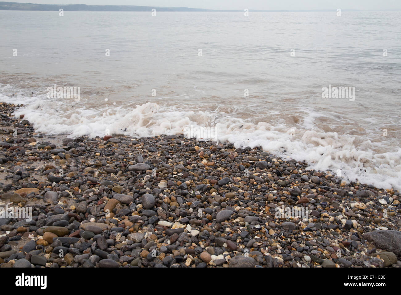 Kiesel-Strand-Hintergrund Stockfoto