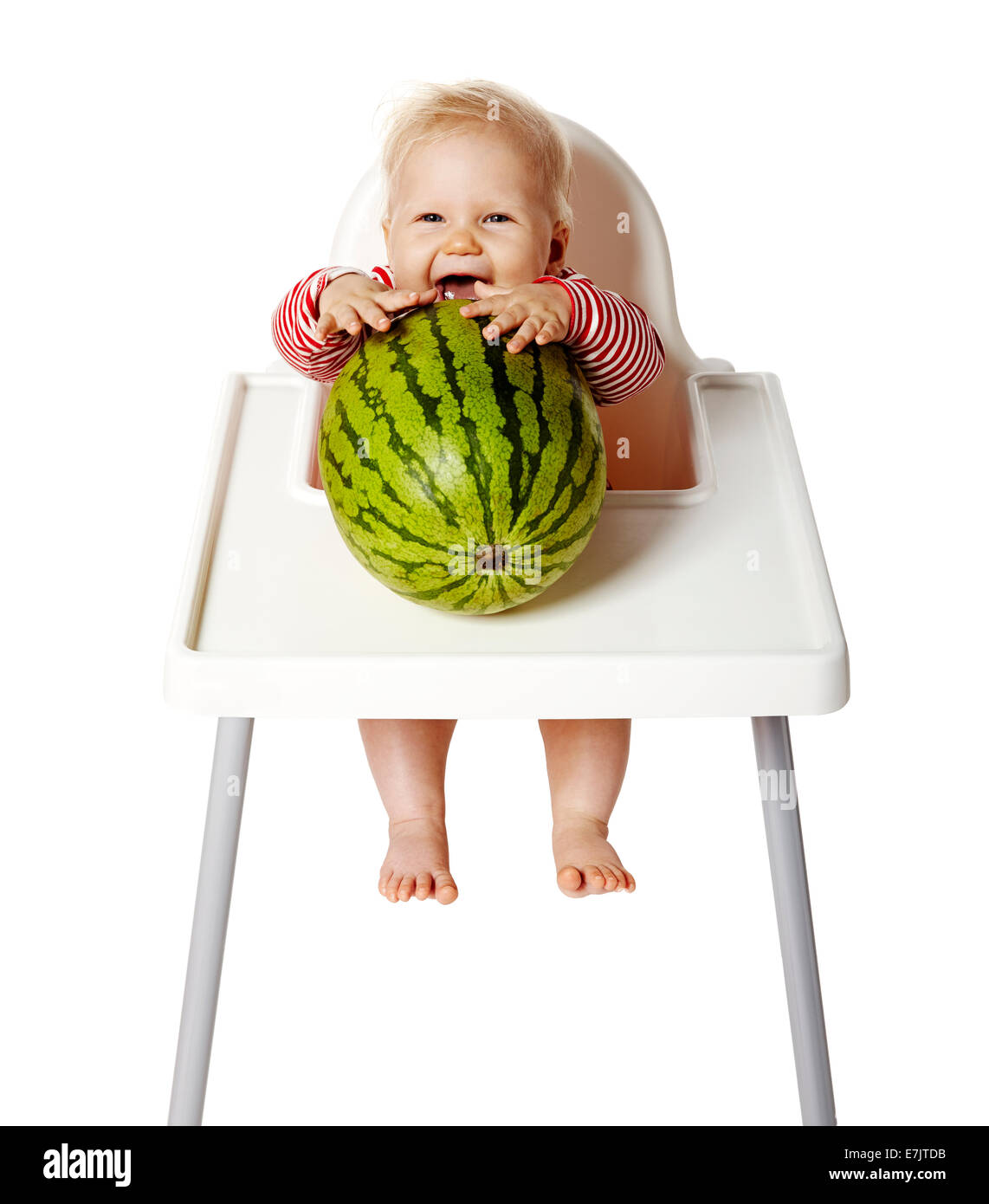 Kleines Baby versucht, Wassermelone essen. Isoliert auf weiss. Stockfoto
