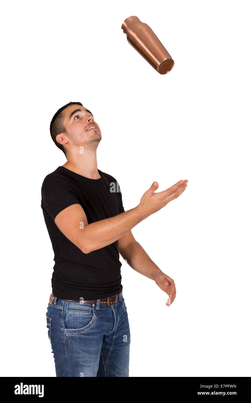 junger Mann auf einem weißen Hintergrund jonglieren Stockfoto