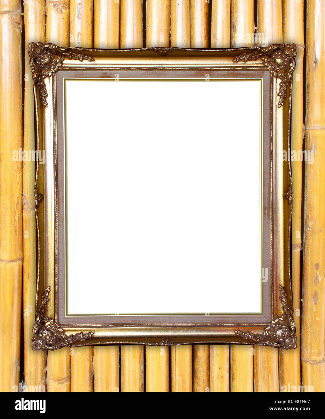 leere Goldrahmen auf bunten Bambus Wand Hintergrund Stockfoto