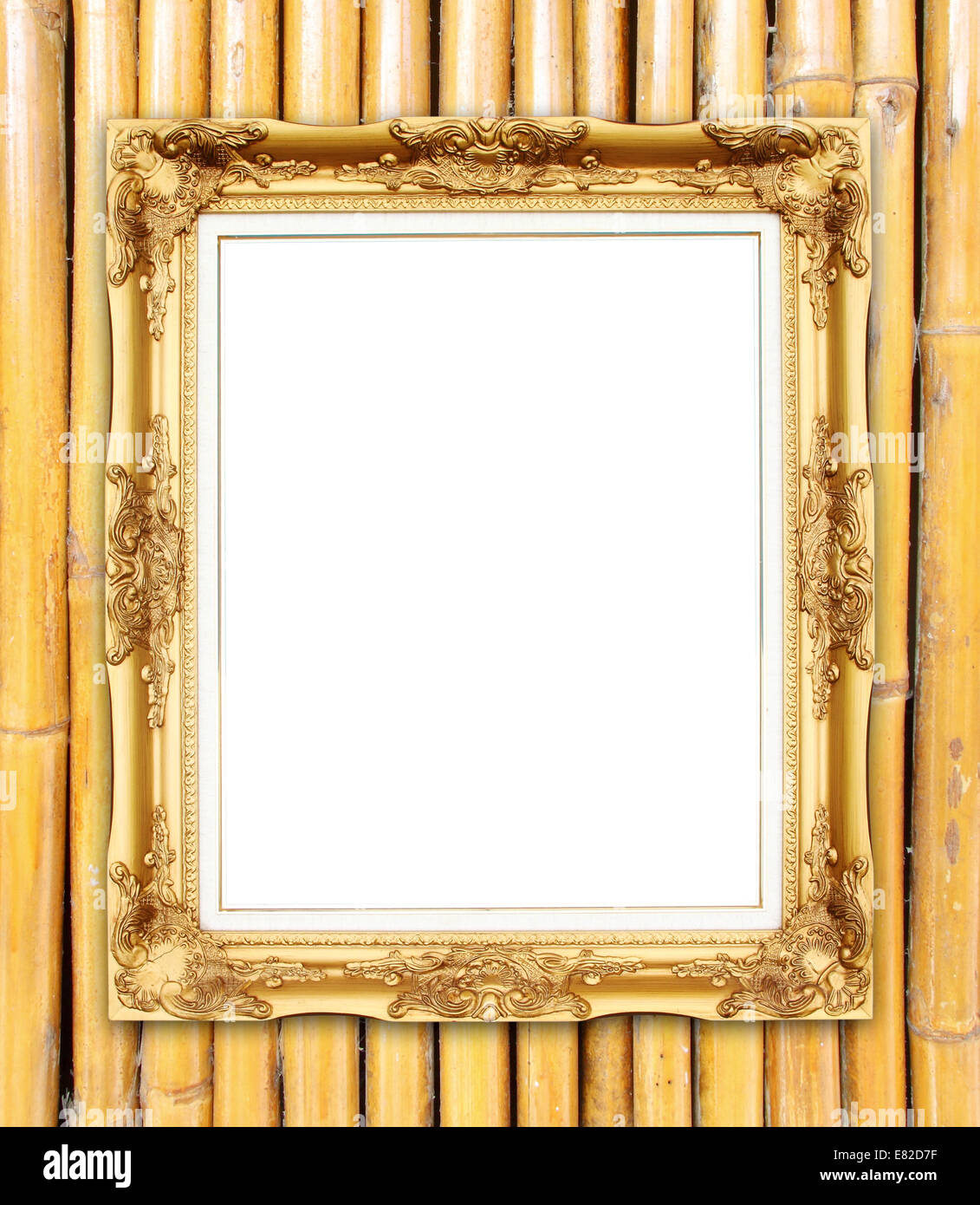 leere Goldrahmen auf bunten Bambus Wand Hintergrund Stockfoto