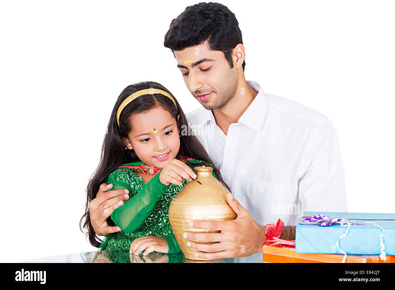 Südindische Vater Geld sparen mit Kind Stockfoto