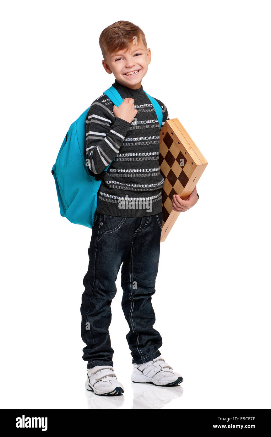 Junge mit Rucksack und Schachbrett Stockfoto