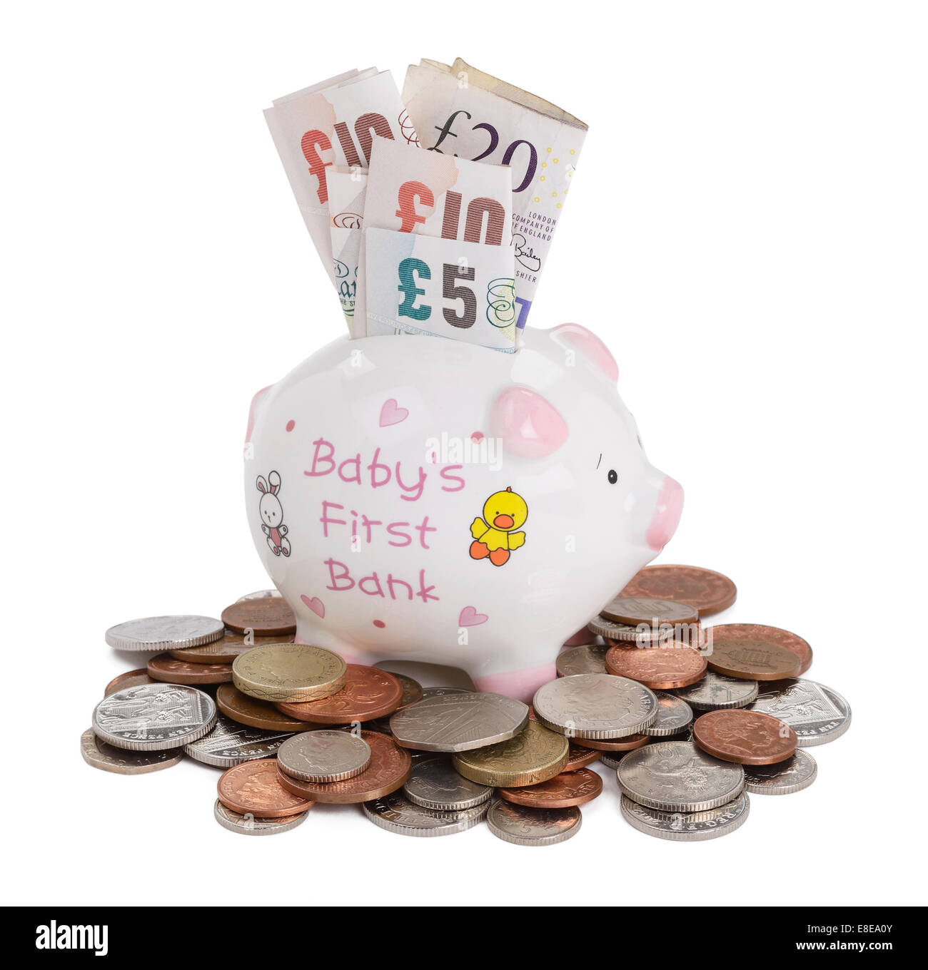 Baby-Sparschwein mit UK Sterling Münzen und Banknoten Stockfoto
