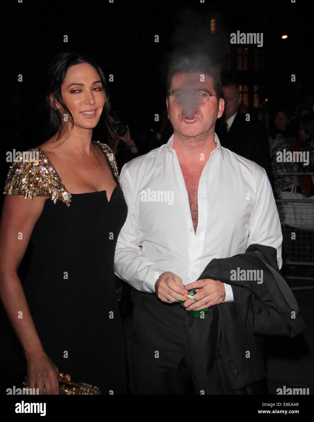 London, UK. 6. Oktober 2014. Simon Cowell und Lauren Silverman besuchen die Pride of Britain Awards im The Grosvenor House Hotel Stockfoto