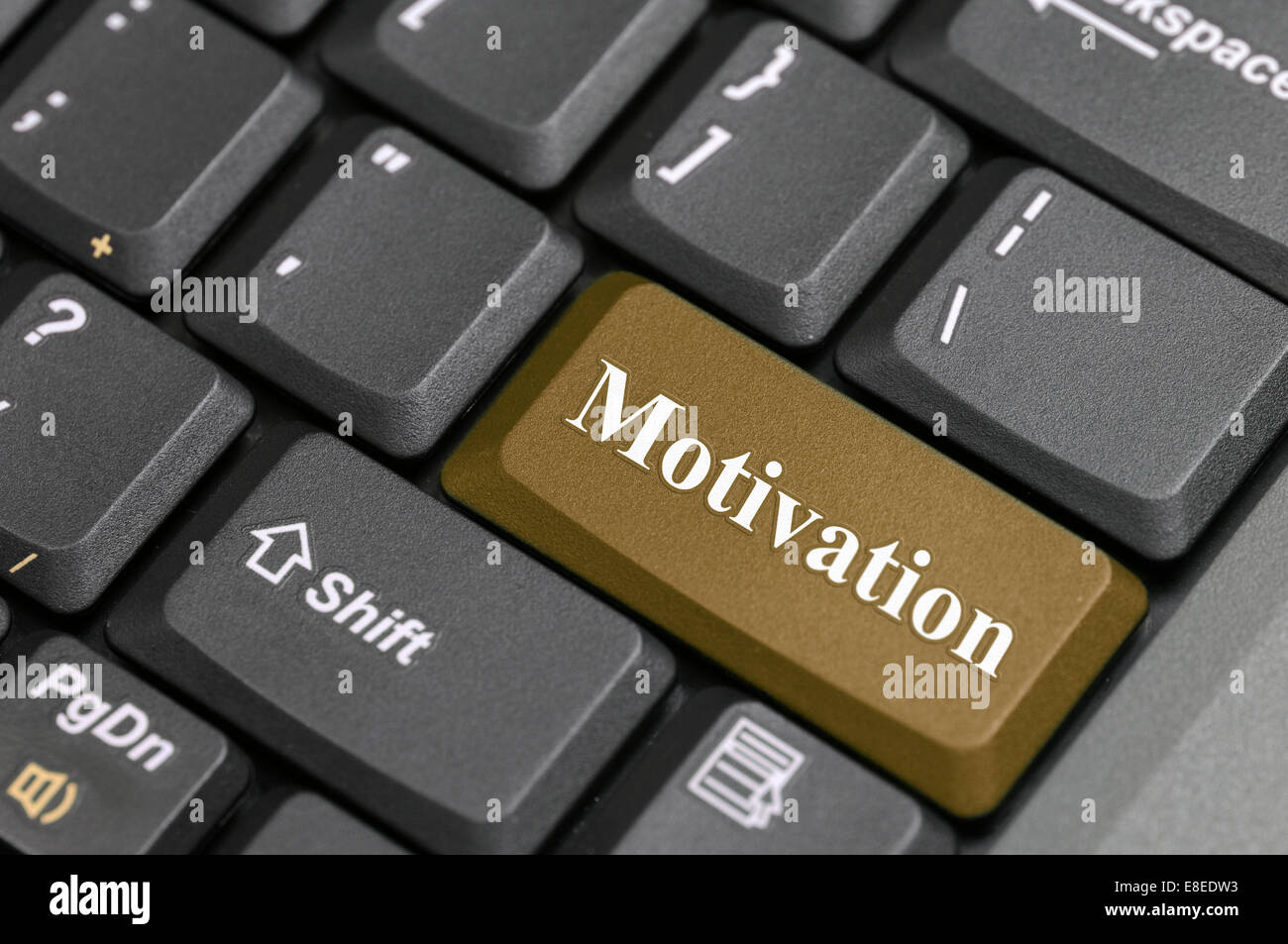 Braune Motivation-Taste auf der Tastatur Stockfoto