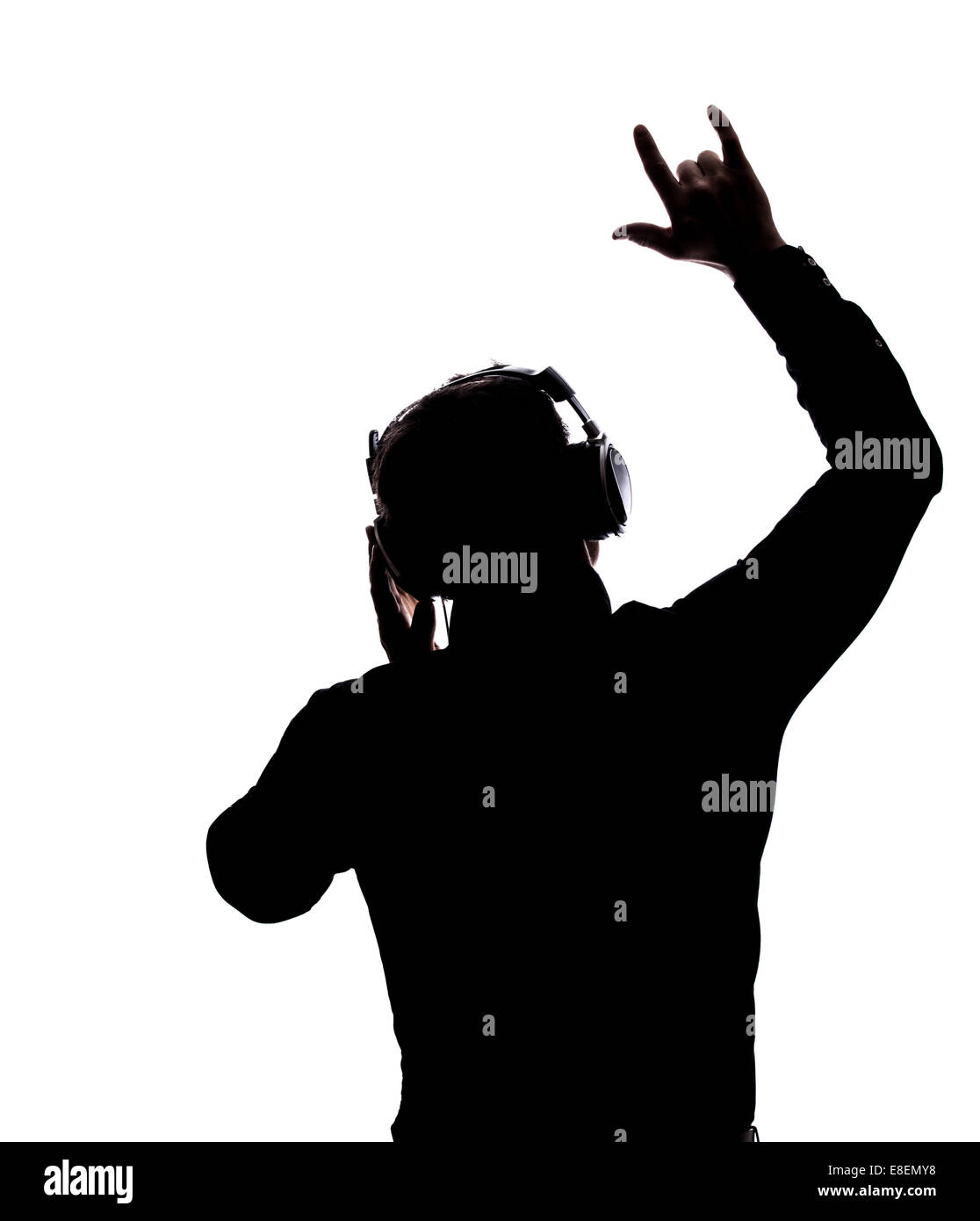 Mann, Schaukeln auf mit Kopfhörern in der Silhouette isoliert auf weißem Hintergrund Stockfoto