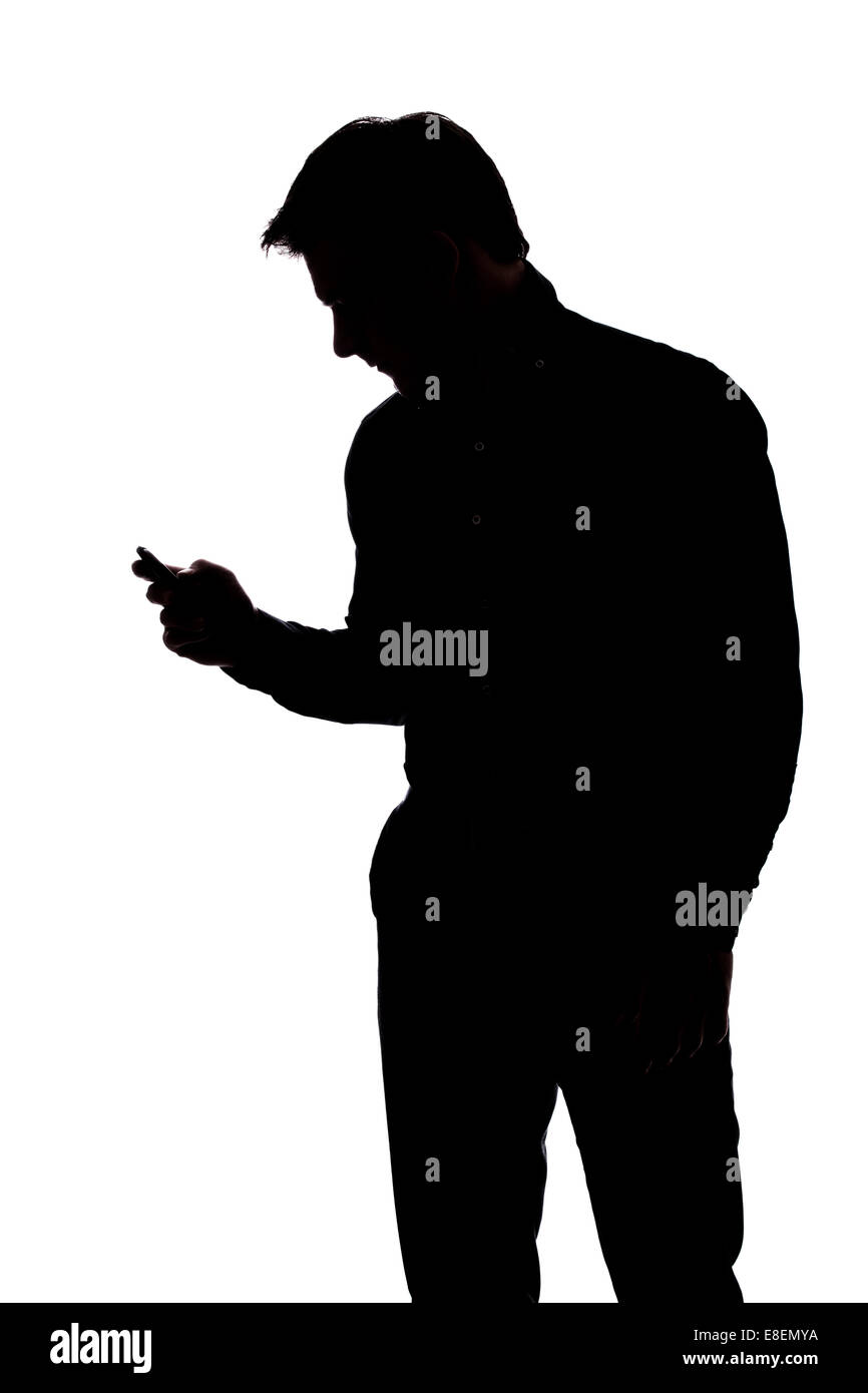 Mann-SMS mit einer Hand in der Silhouette isoliert auf weißem Hintergrund Stockfoto