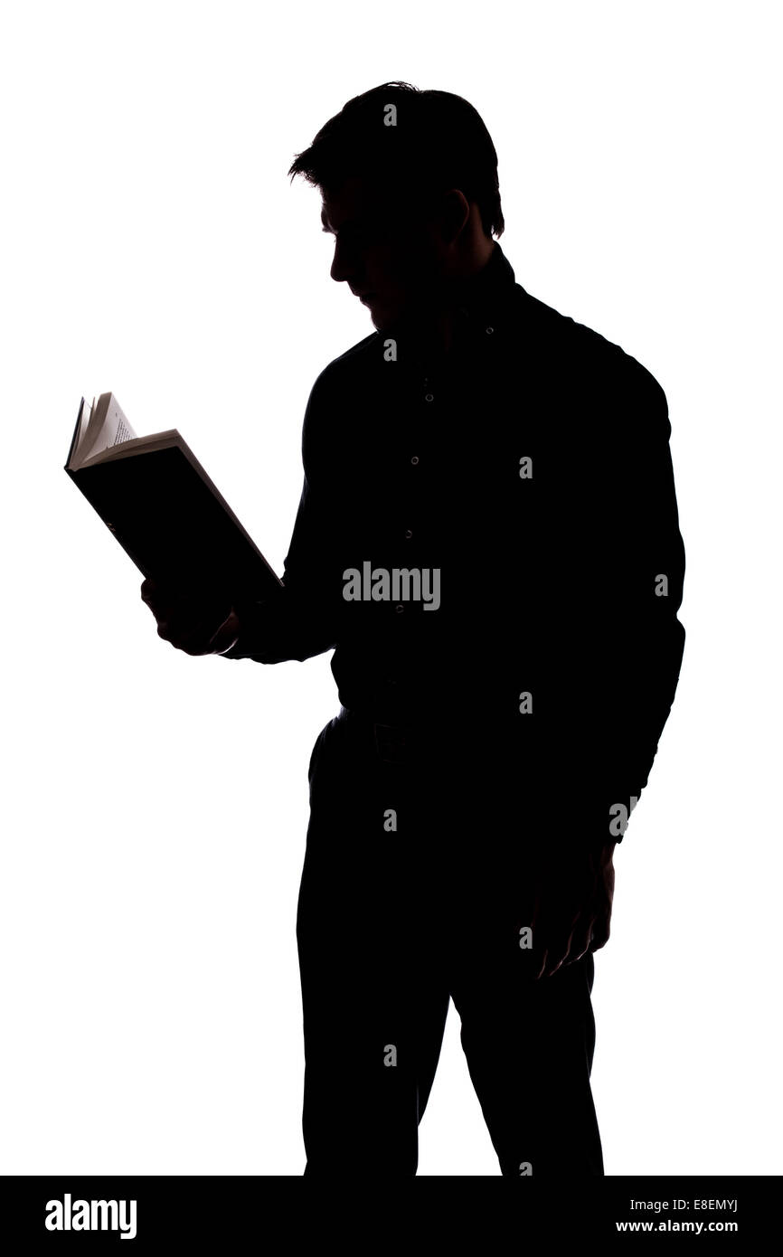 Man liest ein Buch in der Silhouette und isoliert auf weißem Hintergrund Stockfoto